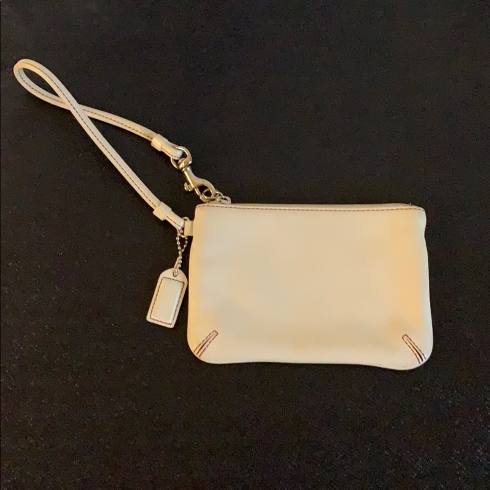 Cream Coach leather wristlet